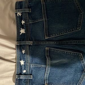 H&M: dark blue flare jeans w/ embroidered flowers